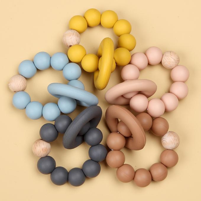 Brinquedo orgânico de borracha natural por atacado de Teether do bebê do silicone infantil com um anel