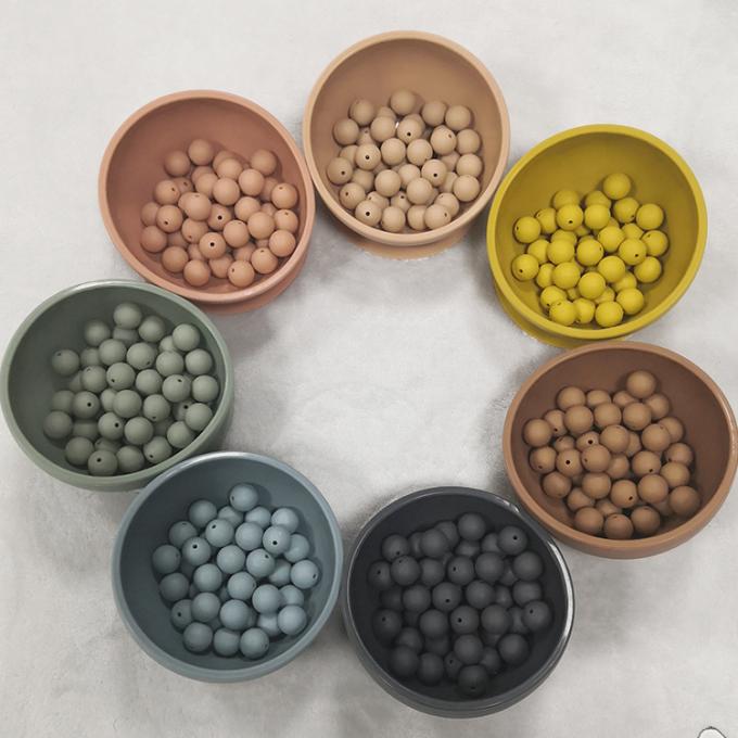 Bebê macio livre dado forma redondo do produto comestível BPA que sai os dentes grânulos fracos do silicone