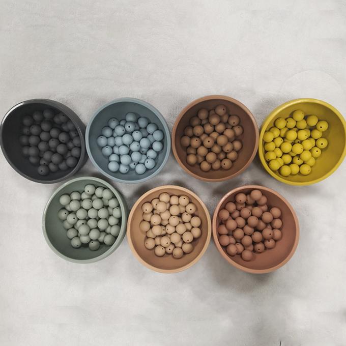Grânulos novos por atacado do silicone da cor em volta dos grânulos dados forma sair os dentes para o bebê
