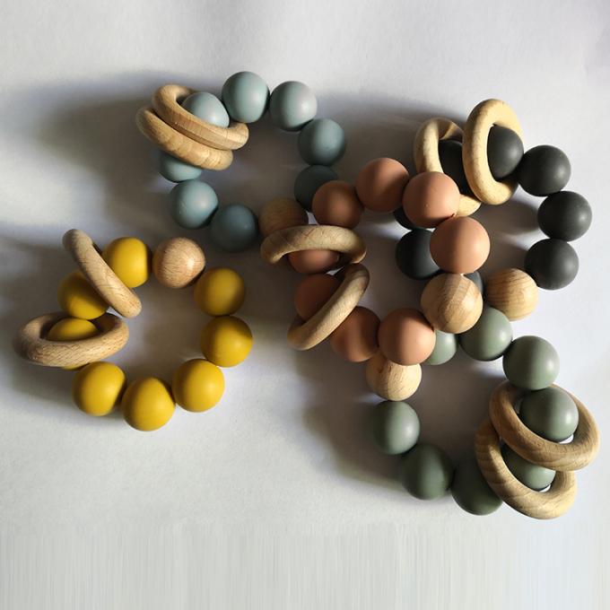 Teether feito sob encomenda do bebê do silicone dos brinquedos dos grânulos do silicone com o bracelete 2 de madeira